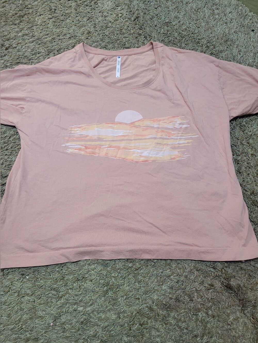 KÜHL Painted Sunset™ Tee in pink featuring a graphic print of a sunrise.